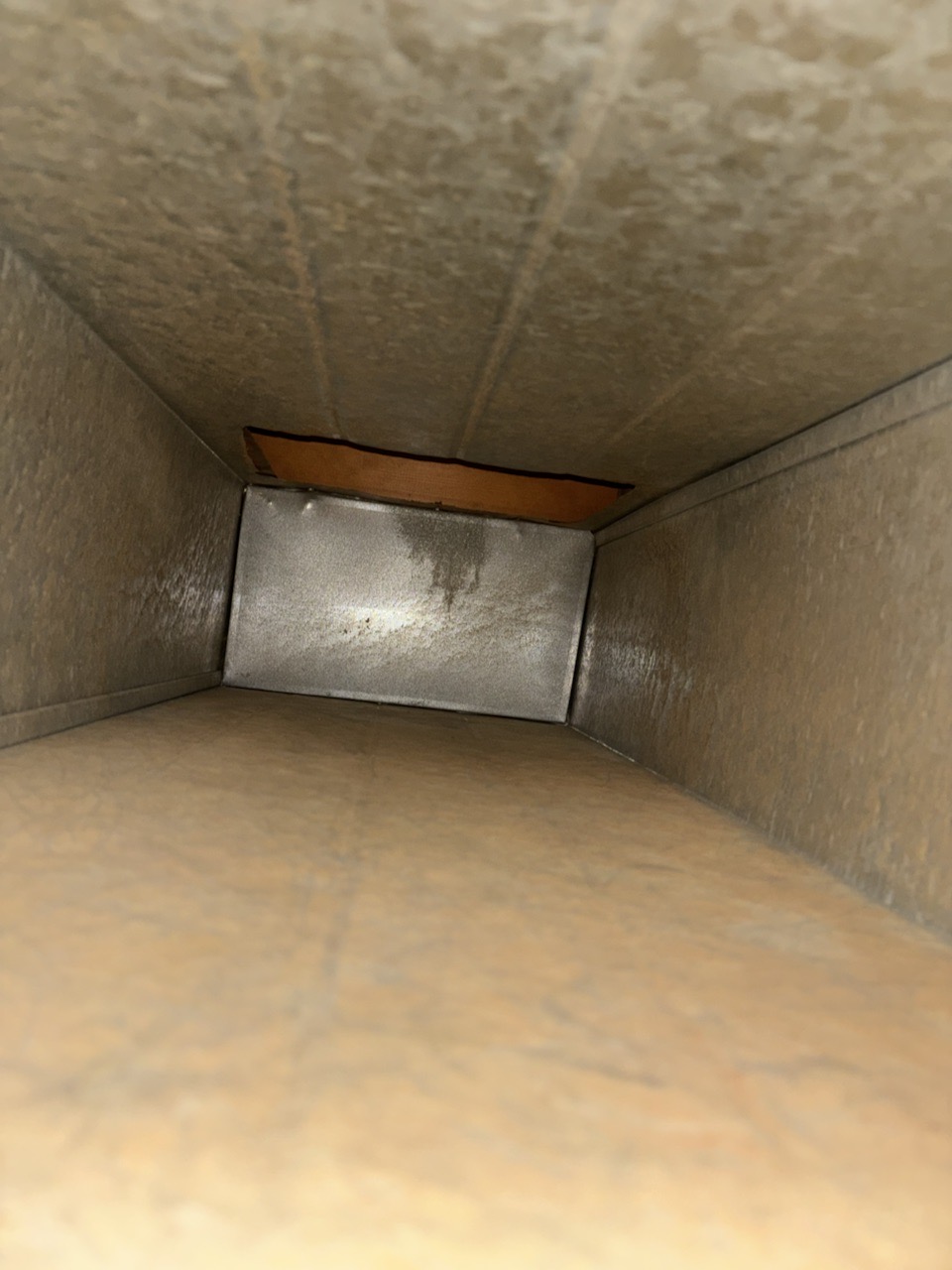 Air duct after professional cleaning showing dust and debris removed